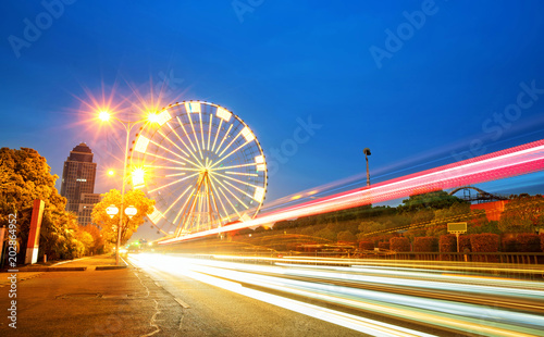 Night, a rotating Ferris wheel.