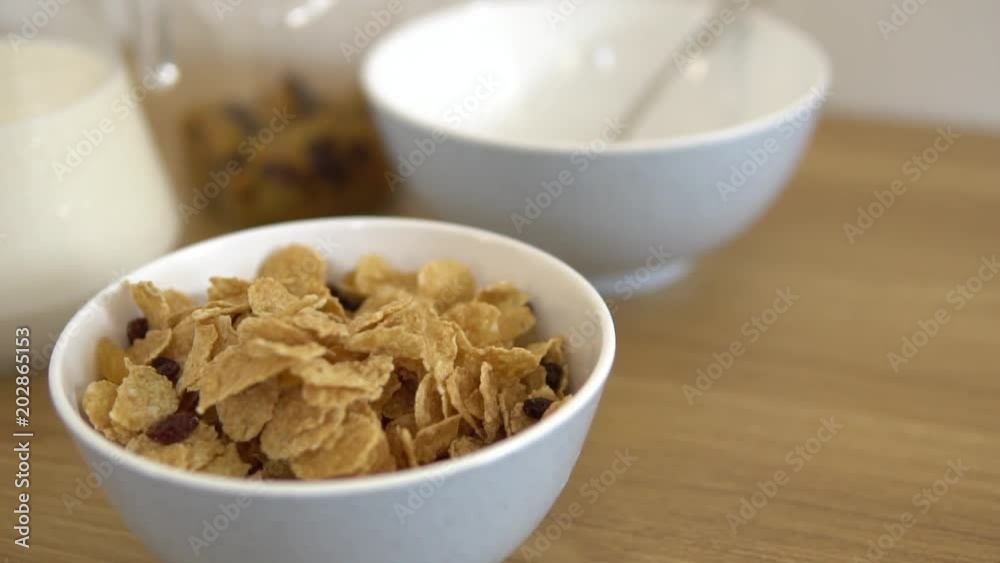 Healthy breakfast with flakes and dry fruits. Served in the early morning as diet meal for good health. Healthy vegeterian food coocked from high quality products . Big crispy flakes in a white plate. Healthy breakfast with flakes and dry fruits. Served in the early morning as diet meal for good health. Healthy vegeterian food coocked from high quality products . Big crispy flakes in a white plate.