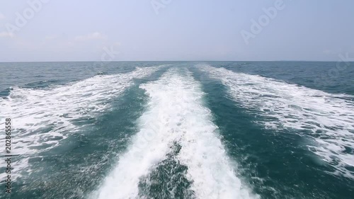 Ship wake on the ocean. Water foam trace behind the large ship goes till the horizon. travel, tourism, vacation and summer holidays concept - blue sea water with boat trace   (1920x1080, 1080p, HD)