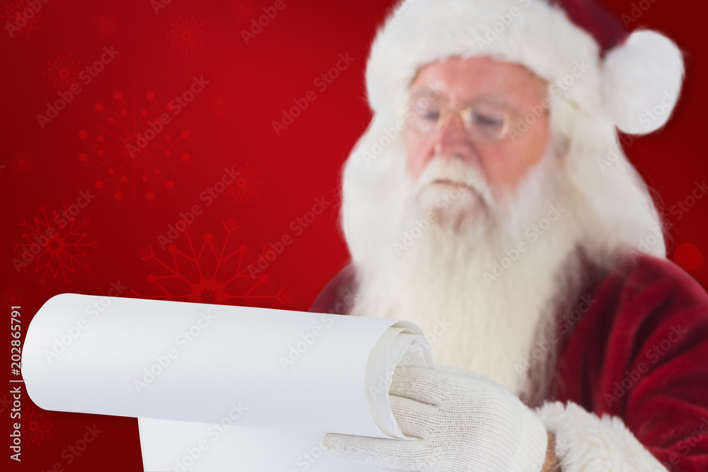 Naklejka premium Santa Claus reads a list against red background