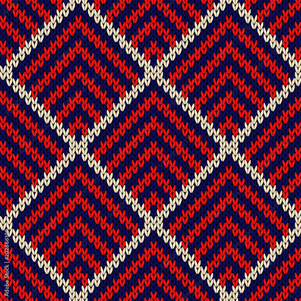Knitted seamless pattern in blue, red and white colors