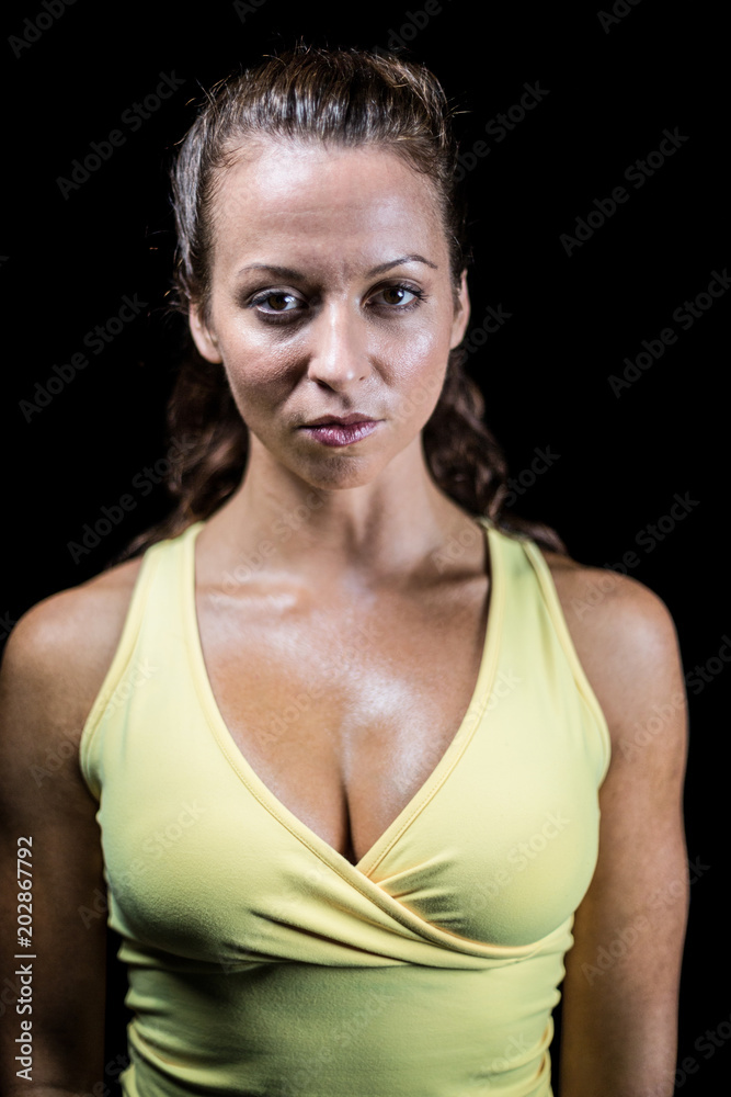 Portrait of confident bodybuilder in yellow sportswear Portrait of confident bodybuilder in yellow sportswear