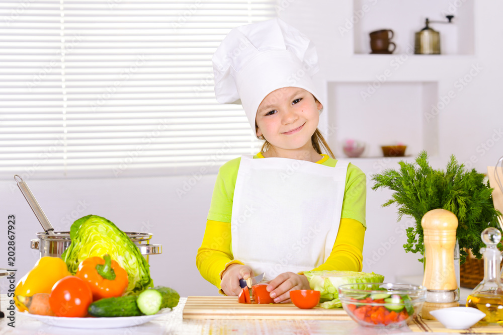 girl wearing chef uniform cooking on kitchen girl wearing chef uniform cooking on kitchen
