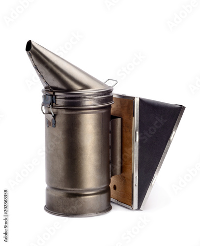 Chimney for flashing bees. The beekeeper's tool. Bee smoker smoking. photo