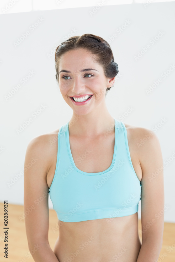 Smiling young woman in blue sports bra Smiling young woman in blue sports bra