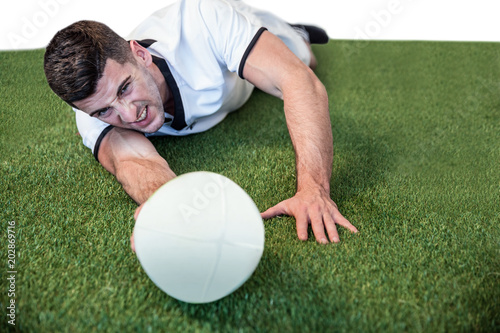 Man lying down while holding ball