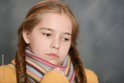 sick girl wearing scarf 