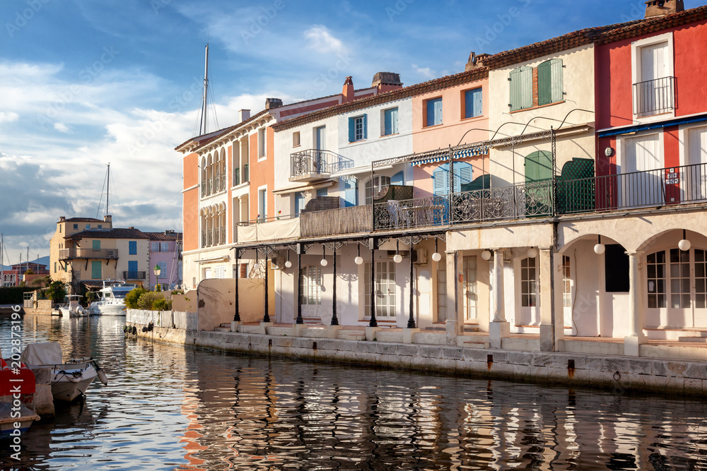 Colorful city on the water, Port of Grimaud, Côte d'Azur, France, Provence, houses and boats. Beautiful city landscape