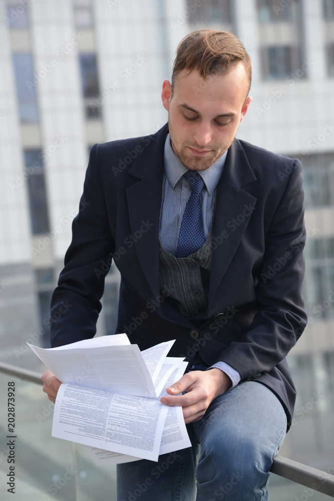 businessman reading paper documents businessman reading paper documents