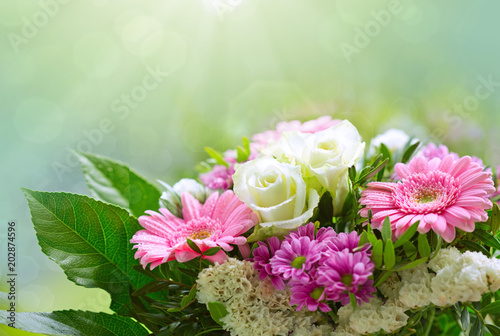 White roses and pink gerbera bouquet.