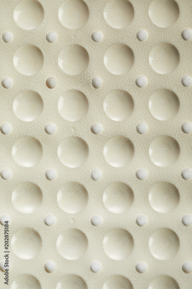 Surface of a pliable rubber bath mat