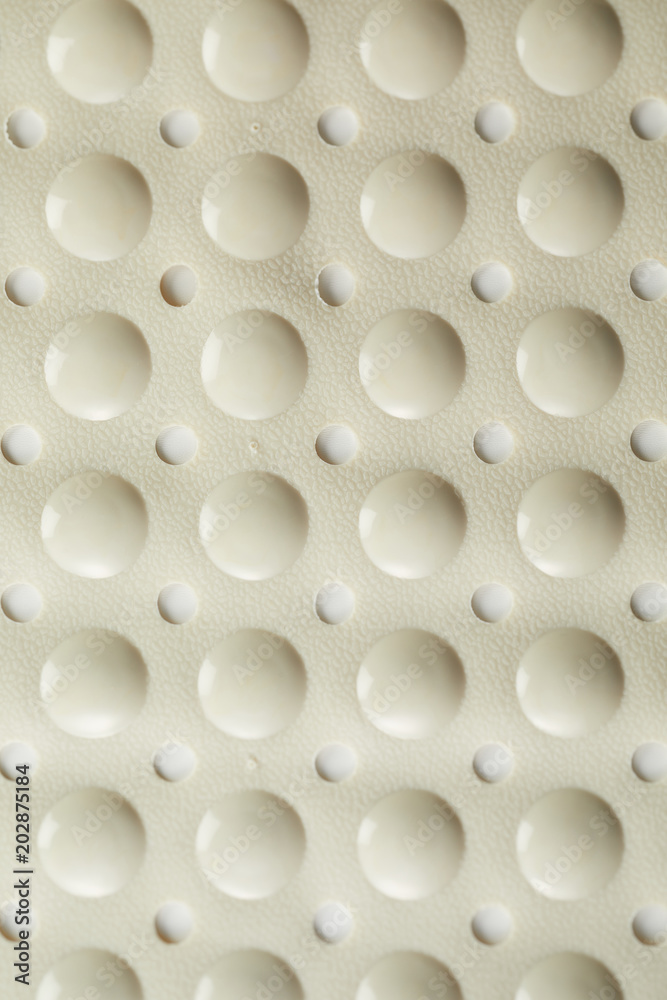 Surface of a pliable rubber bath mat Surface of a pliable rubber bath mat