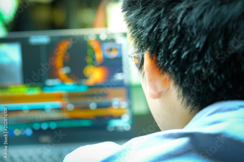 physician with coronary monitor analysis machine in intensive care unit photo