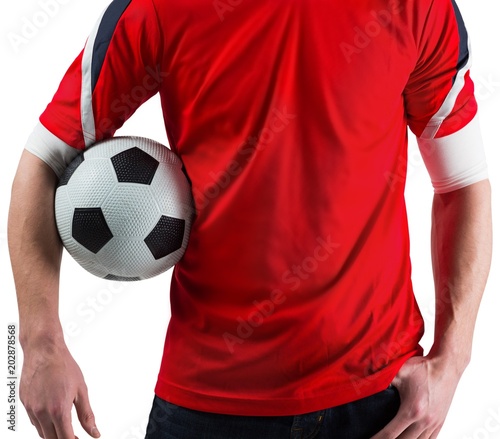 Football fan in red holding ball © WavebreakmediaMicro