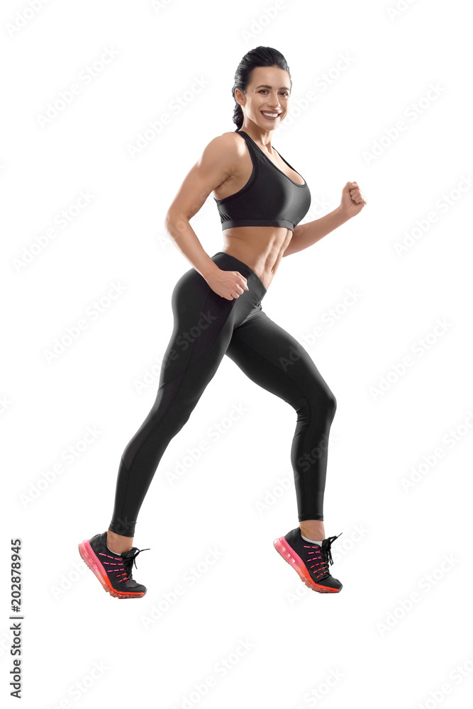 Photo of posing athletic female. Smiling woman with fit, curvy