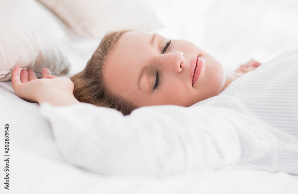 Peaceful pretty woman sleeping on her bed Peaceful pretty woman sleeping on her bed