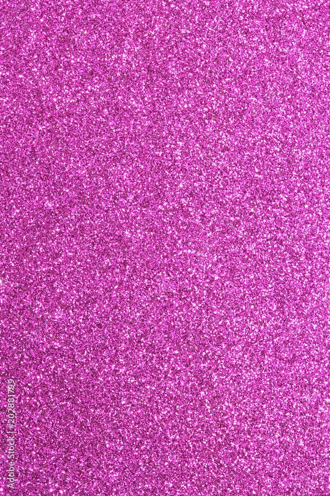 Magenta glitter background in reflective and shimmering material