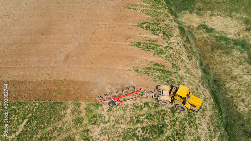 Aerial view of a tractor on a field.