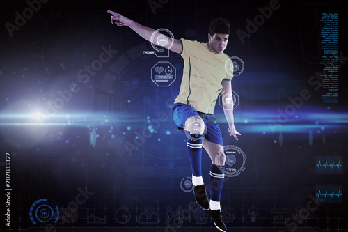 Football player against blue dots on black background
