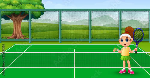 Cute little girl playing tennis at the courts