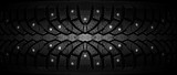  Winter rubber with spikes on a black background close-up.
