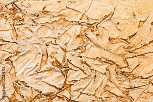 Background of a yellow stucco coated and painted exterior, rough cast of cement and concrete wall texture