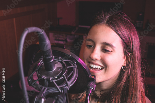 Photography Singing girl singing with a microphone
