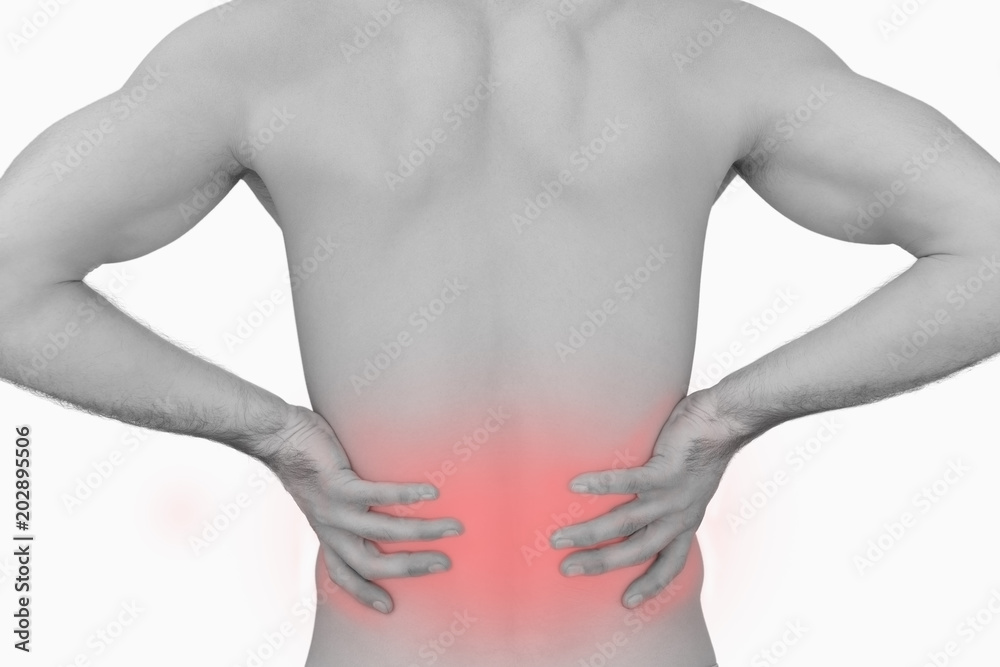 Rear view of muscular man with backache over white background