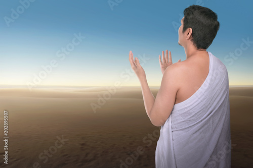Religious asian hajj man praying