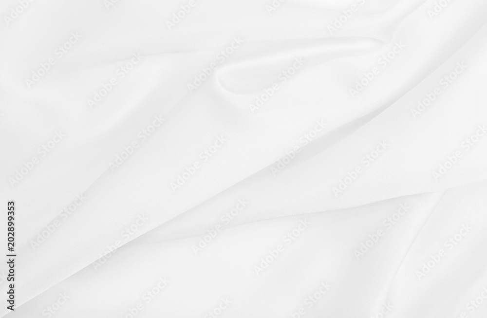 Obraz premium Smooth elegant white silk or satin luxury cloth texture as wedding background. Luxurious background design