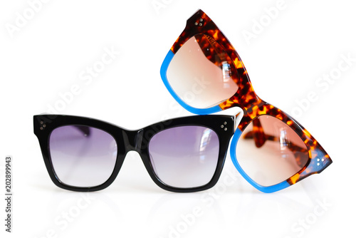 Stylish women's sunglasses on white background