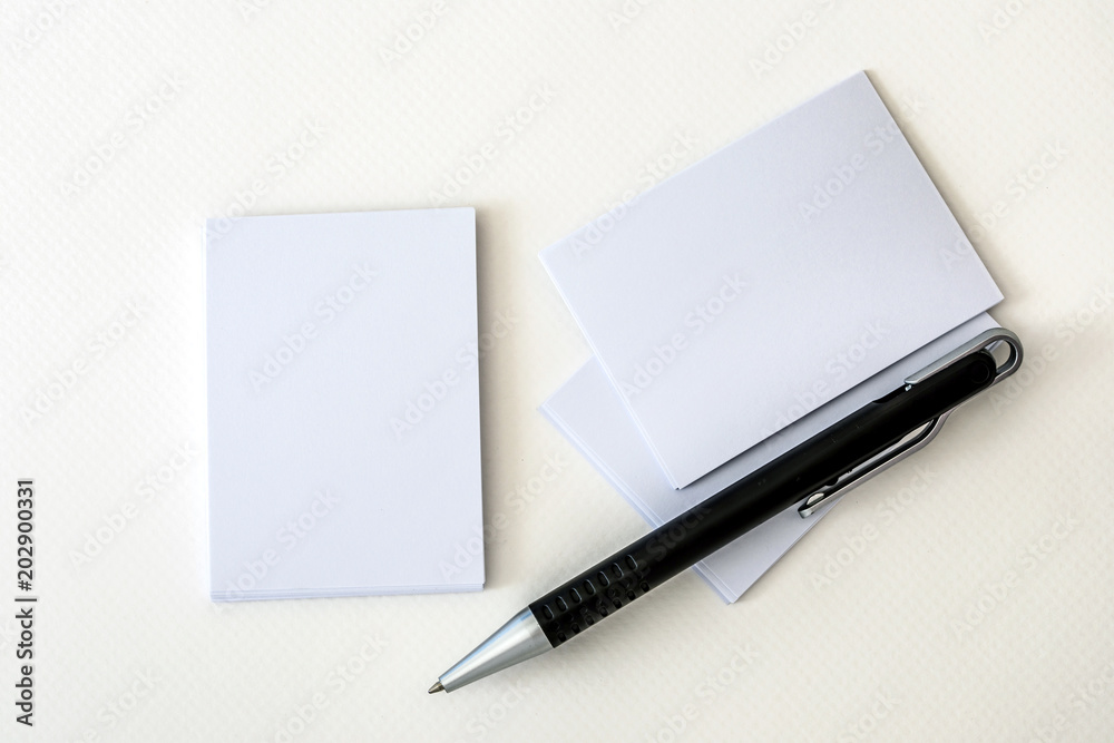stacking of a mockup empty white business card with elegance pen on white paper background , template for business branding identity design stacking of a mockup empty white business card with elegance pen on white paper background , template for business branding identity design