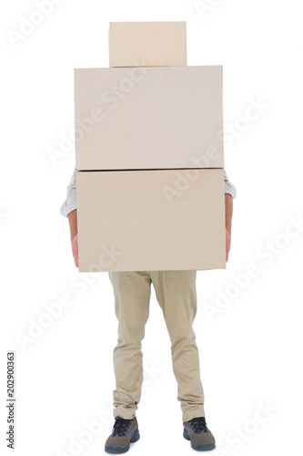 Courier man carrying cardboard boxes