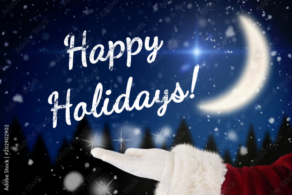 Naklejka premium Santa Claus shows open hand against crescent moon over forest at night