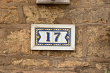 House number 17 sign in ceramic tiles on wall