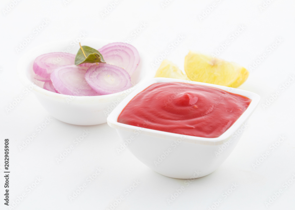 Tomato Sauce Ketchup with Onion and Lemon Isolated on White Background Tomato Sauce Ketchup with Onion and Lemon Isolated on White Background