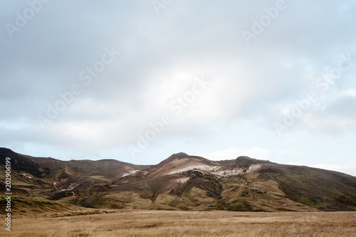 Endless Icelandic Highway between fields. Mountains