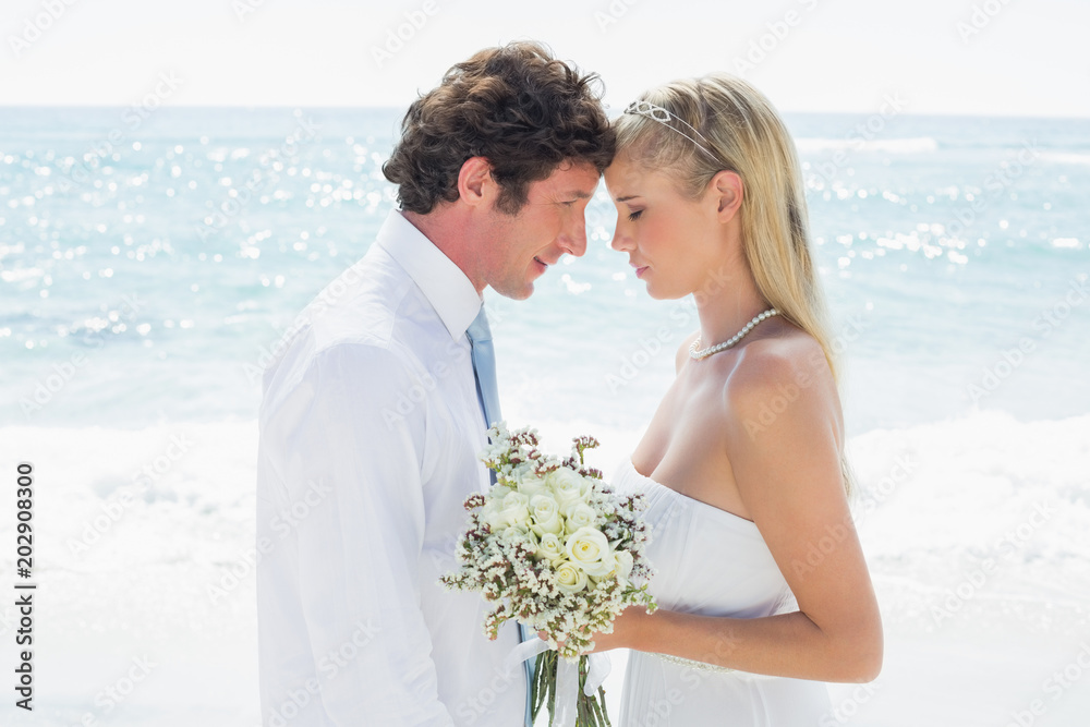 Happy couple embracing each other on their wedding day