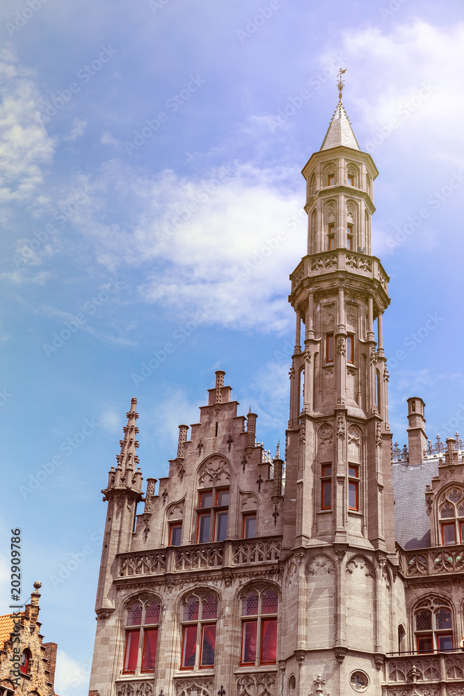 Tower of Provincial Palace in Bruges on sunny day
