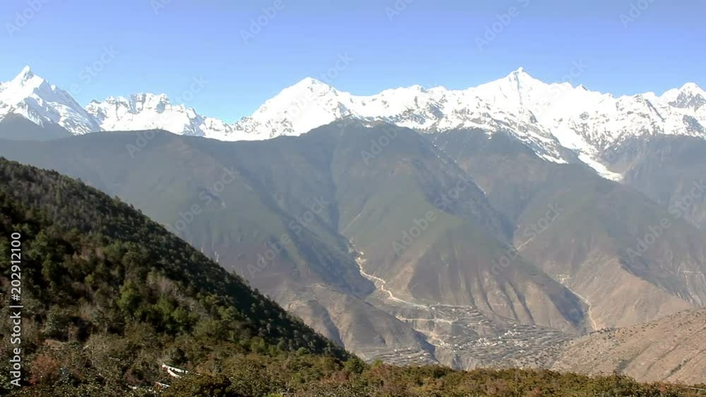 Amazing nature landscape of Meili snow mountains from Feilai temple viewpoint in Deqing, China. Touristic travel destination concept Amazing nature landscape of Meili snow mountains from Feilai temple viewpoint in Deqing, China. Touristic travel destination concept