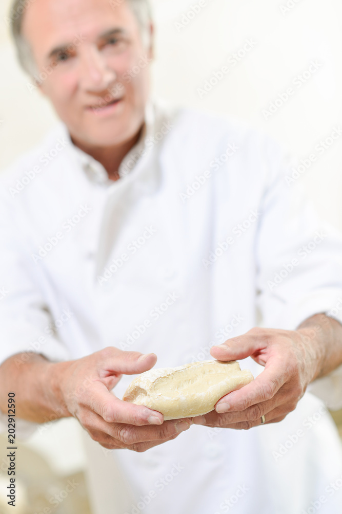 Baker holding pastry in his hands Baker holding pastry in his hands