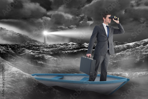Businessman in boat with binoculars against stormy sea with lighthouse