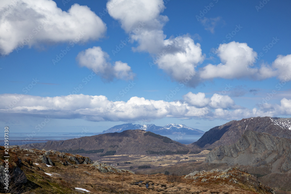 Blue skies and clouds in great spring  weather on Bronnoy mountain in Northern Norway