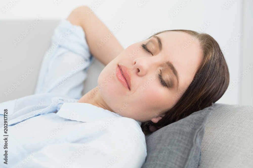 Close up of a well dressed beautiful woman sleeping on sofa Close up of a well dressed beautiful woman sleeping on sofa