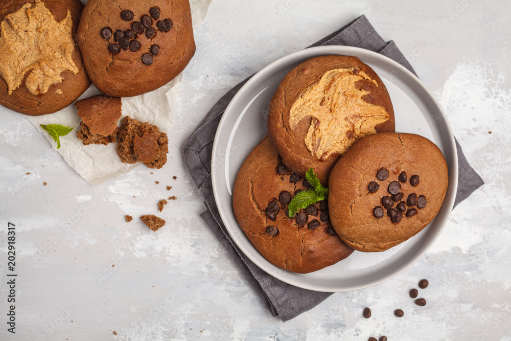 Vegan aquafaba peanut butter cookies with carob and chocolate drops, top view. Healthy vegan food concept. Vegan aquafaba peanut butter cookies with carob and chocolate drops, top view. Healthy vegan food concept.