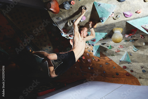 man climber climbs indoors