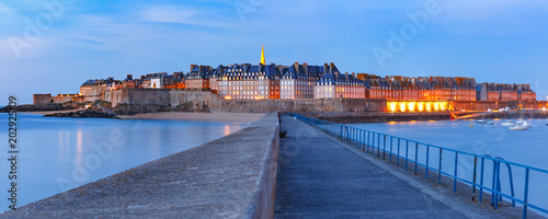 Panoramic night view of walled city Saint-Malo with St Vincent Cathedral, famous port city of Privateers is known as city corsaire, Brittany, France