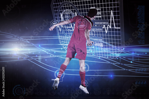 Fit football player jumping up against futuristic blue lines on black background