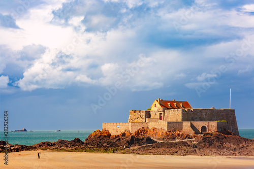 Fort National and beach at low tide, in beautiful walled port city of Privateers Saint-Malo, also known as city corsaire, Brittany, France