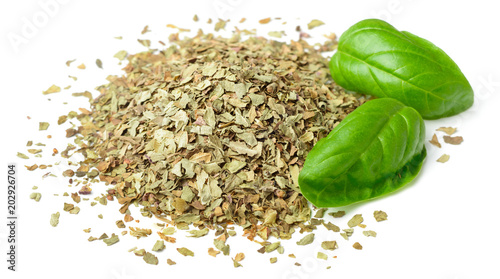 dried crushed basil leaves and fresh basil isolated on white
